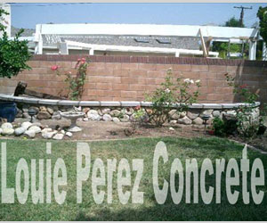 Long Brick Wall and Stone Bed with Plants